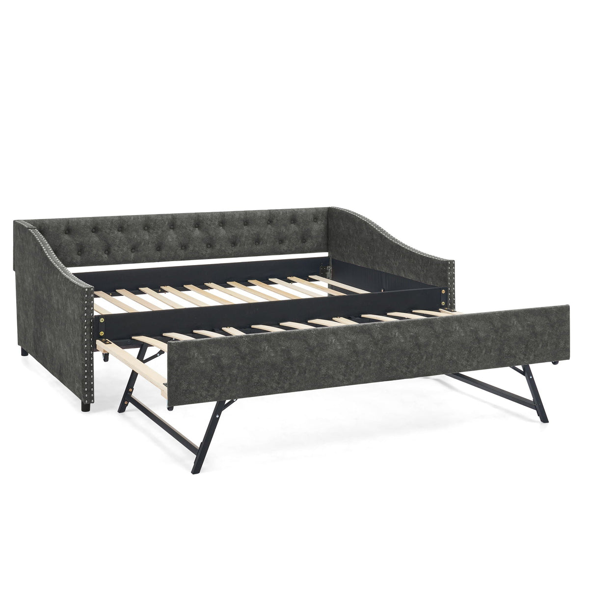 Upholstered daybed with pull-out trundle in gray fabric, tufted back and nailhead trim on Tampa Home & Garden Store