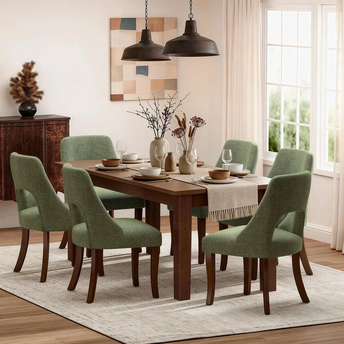 Six green upholstered dining chairs with curved legs around a wooden table in a dining room on Tampa Home & Garden Store