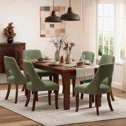 Six green tufted chenille dining chair set with curved legs around a wooden dining table on Tampa Home & Garden Store