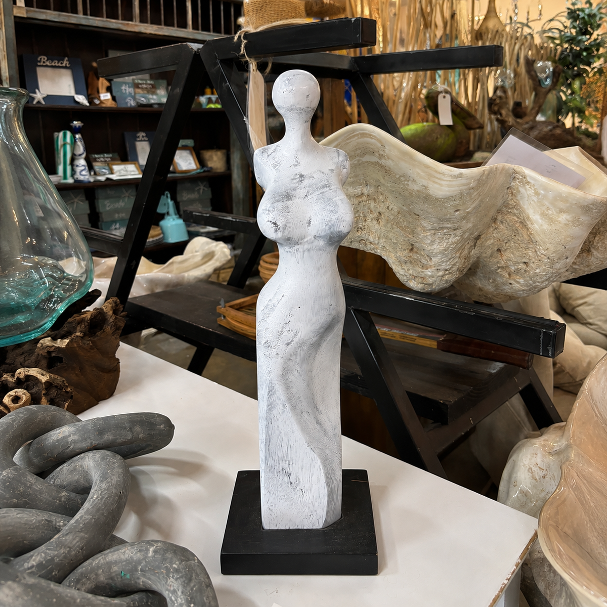 Hand-Carved Abstract Female Sculpture blue on black pedestal by The Broward Design Center on Tampa Home & Garden Store