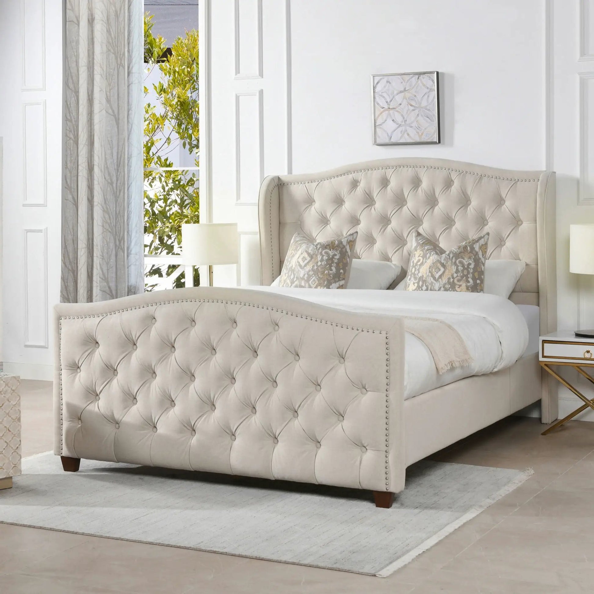 Marcella upholstered shelter bed set by Unique Piece Furniture in beige tufted fabric with nailhead trim on Tampa Home & Garden Store