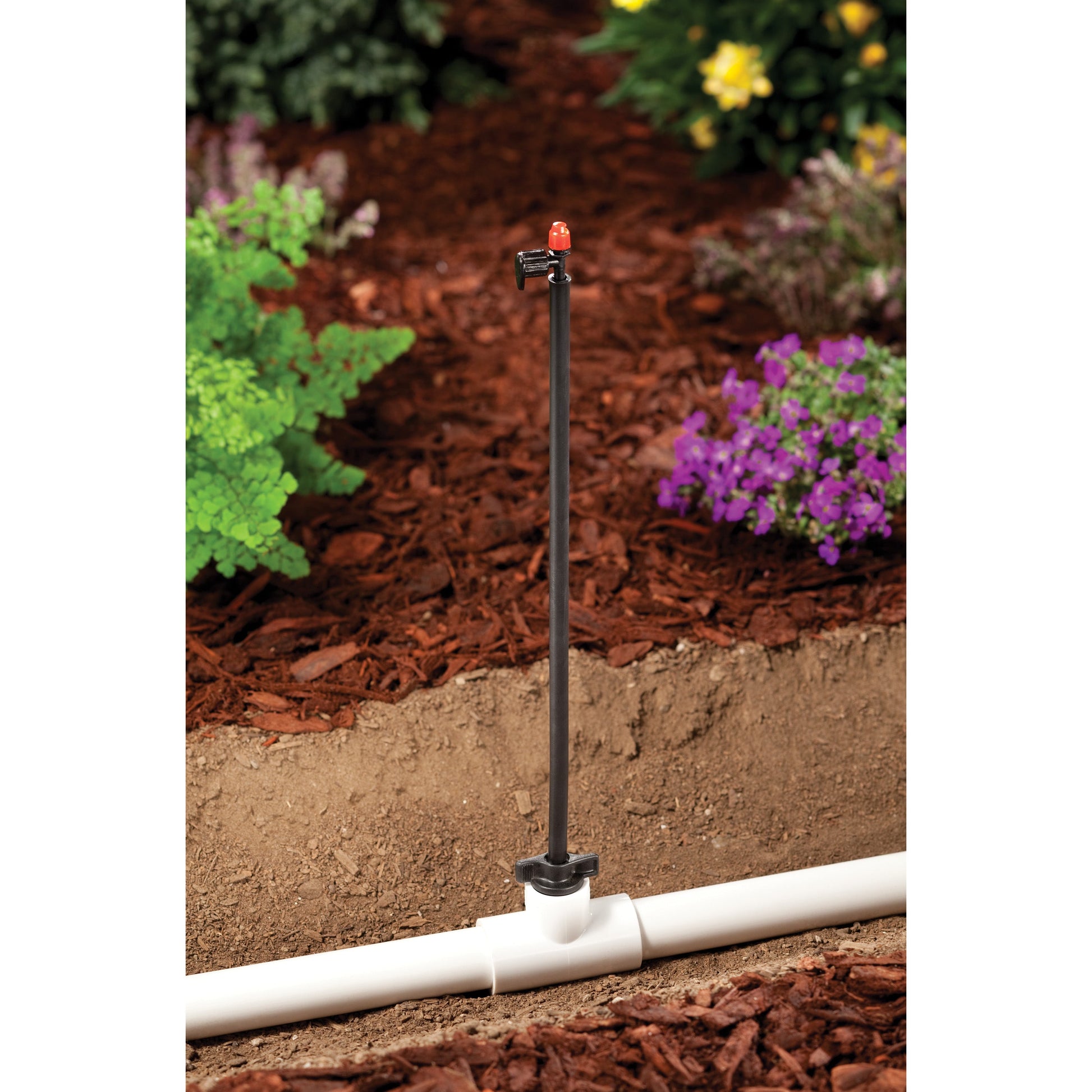 1/2 in MPT x 12 in drip riser with red cap on stake over PVC in garden Orbit Irrigation on Tampa Home & Garden Store