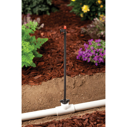 1/2 in MPT x 12 in drip riser with red cap on stake over PVC in garden Orbit Irrigation on Tampa Home & Garden Store