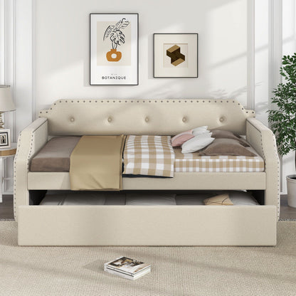 Upholstered beige daybed with pull-out trundle, tufted cushion and nailhead trim on Tampa Home & Garden Store