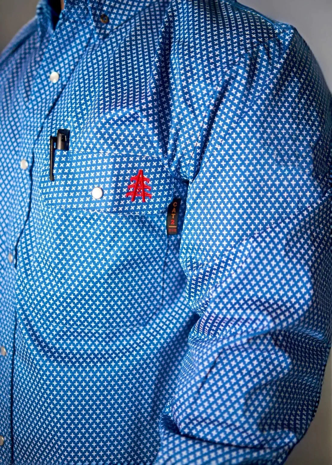 Static FR pearl snap work shirt in royal blue with white micro cross pattern and red chest logo on Tampa Home & Garden Store