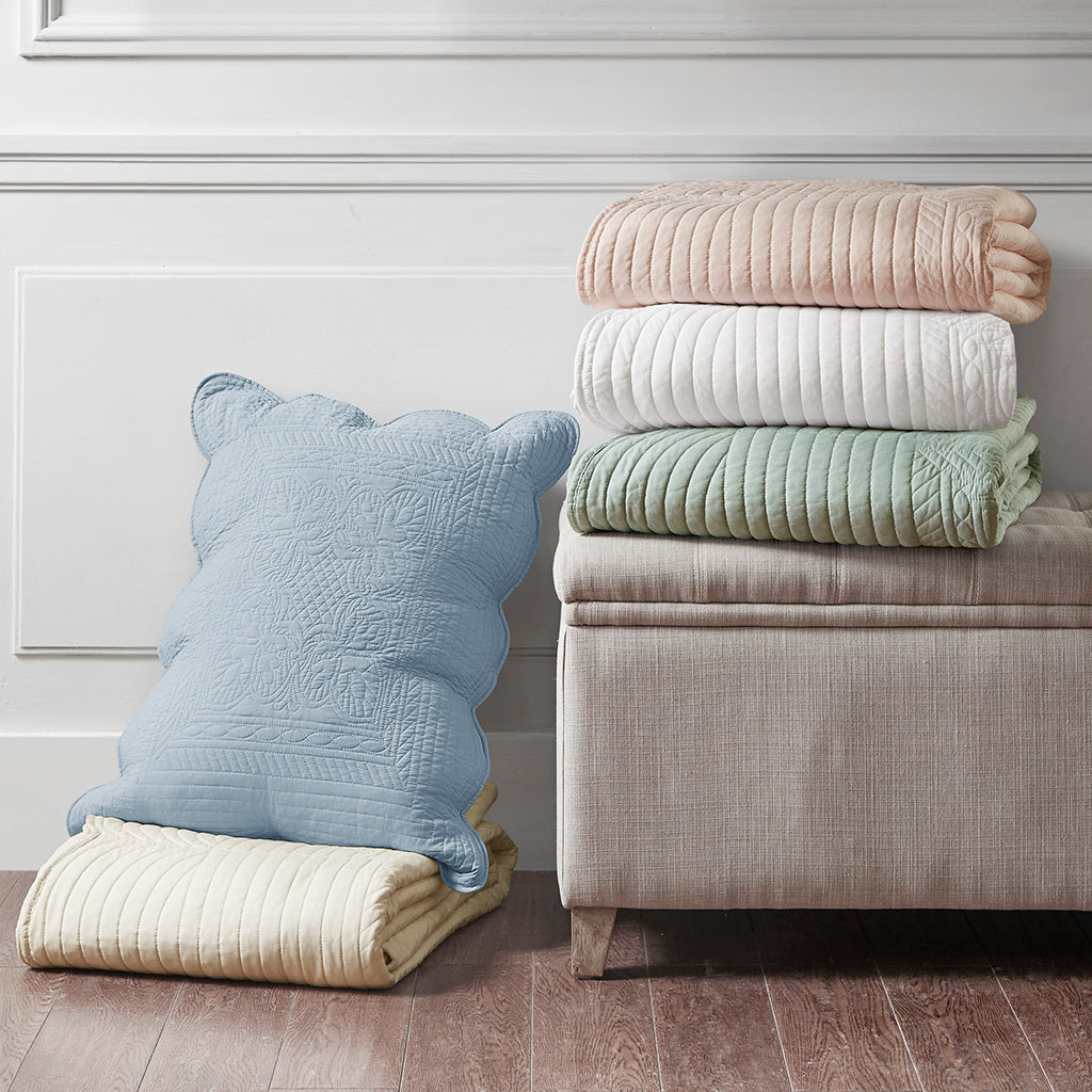 3 Piece Reversible Scalloped Edge Quilt Set by HouseOfZazla blush with pastel stacks on ottoman on Tampa Home & Garden Store