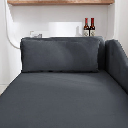 Chaise lounge in gray fabric with a pillow in a contemporary living room setup on Tampa Home & Garden Store