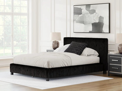Zuraleus upholstered bed by Unique Piece Furniture in black corded fabric with vertical tufting on Tampa Home & Garden Store