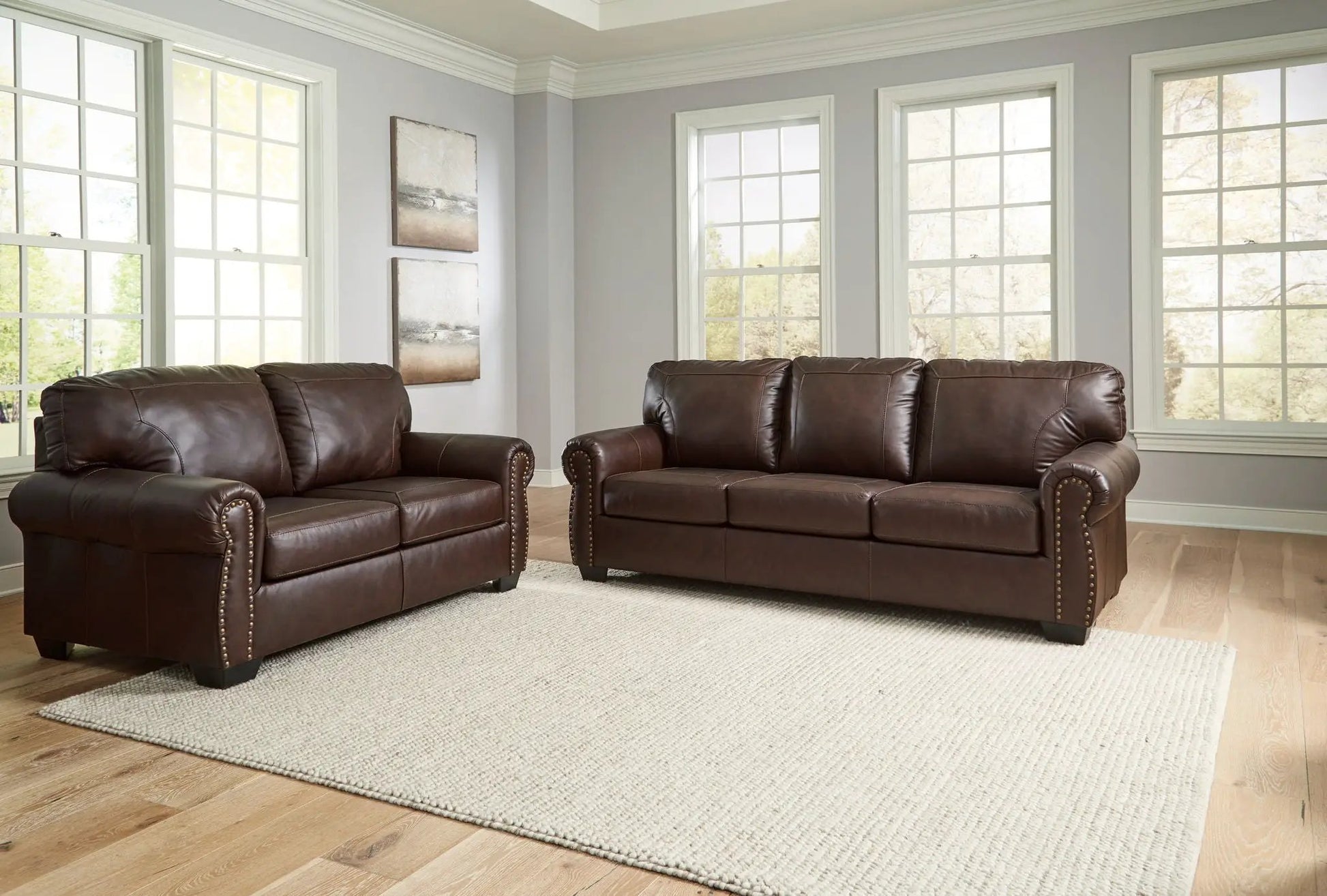 Colleton living room set: 2 dark brown leather stationary sofas with nailhead trim on Tampa Home & Garden Store