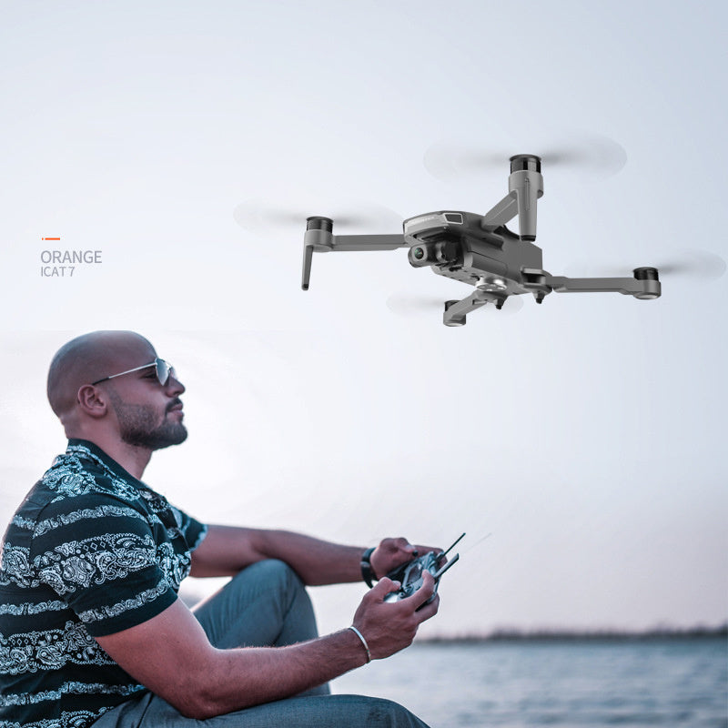 GPS Drone Folding with HD Camera Gimbal, gray Sell My Stuff quadcopter in flight over water on Tampa Home & Garden Store