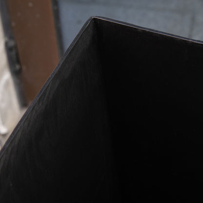 Outdoor tapered planter in faux wood plastic finish, black close-up on Tampa Home & Garden Store