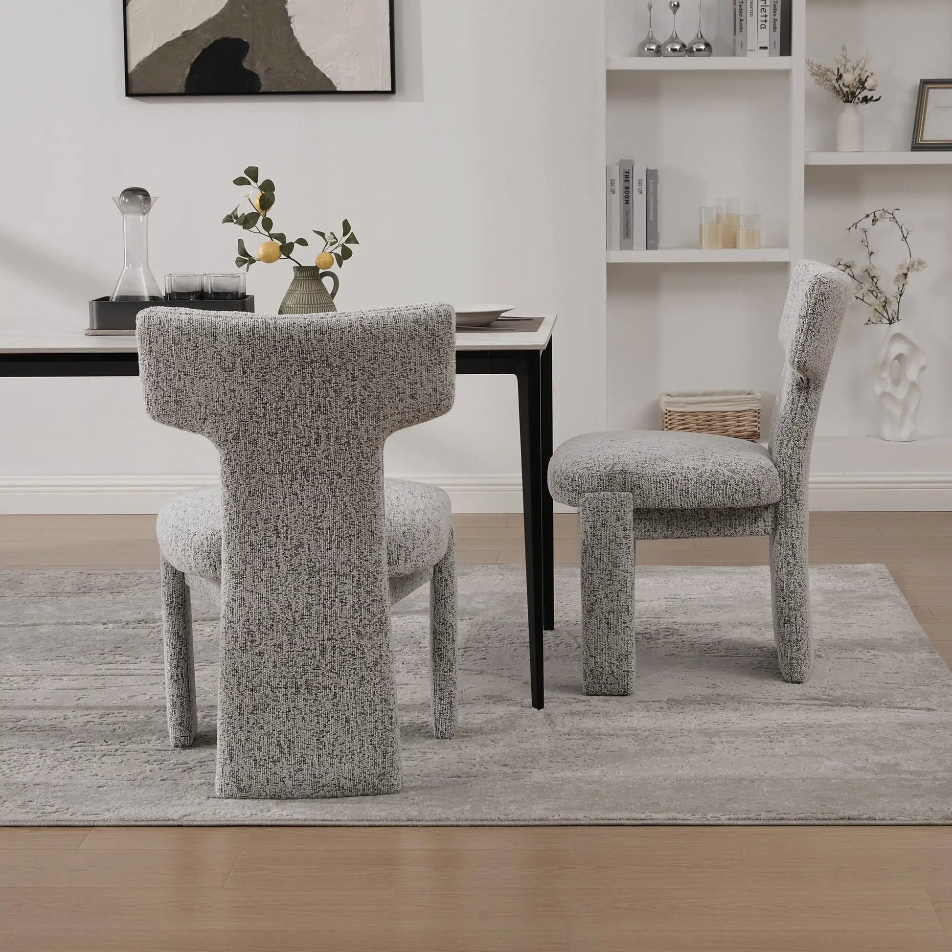 Armless Curved-Back Accent Chairs in gray boucle fabric around a dining table on Tampa Home & Garden Store
