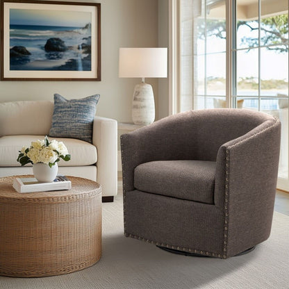 Luxurious pearl silver swivel chair with nailhead trim by HouseOfZazla in a living room on Tampa Home & Garden Store