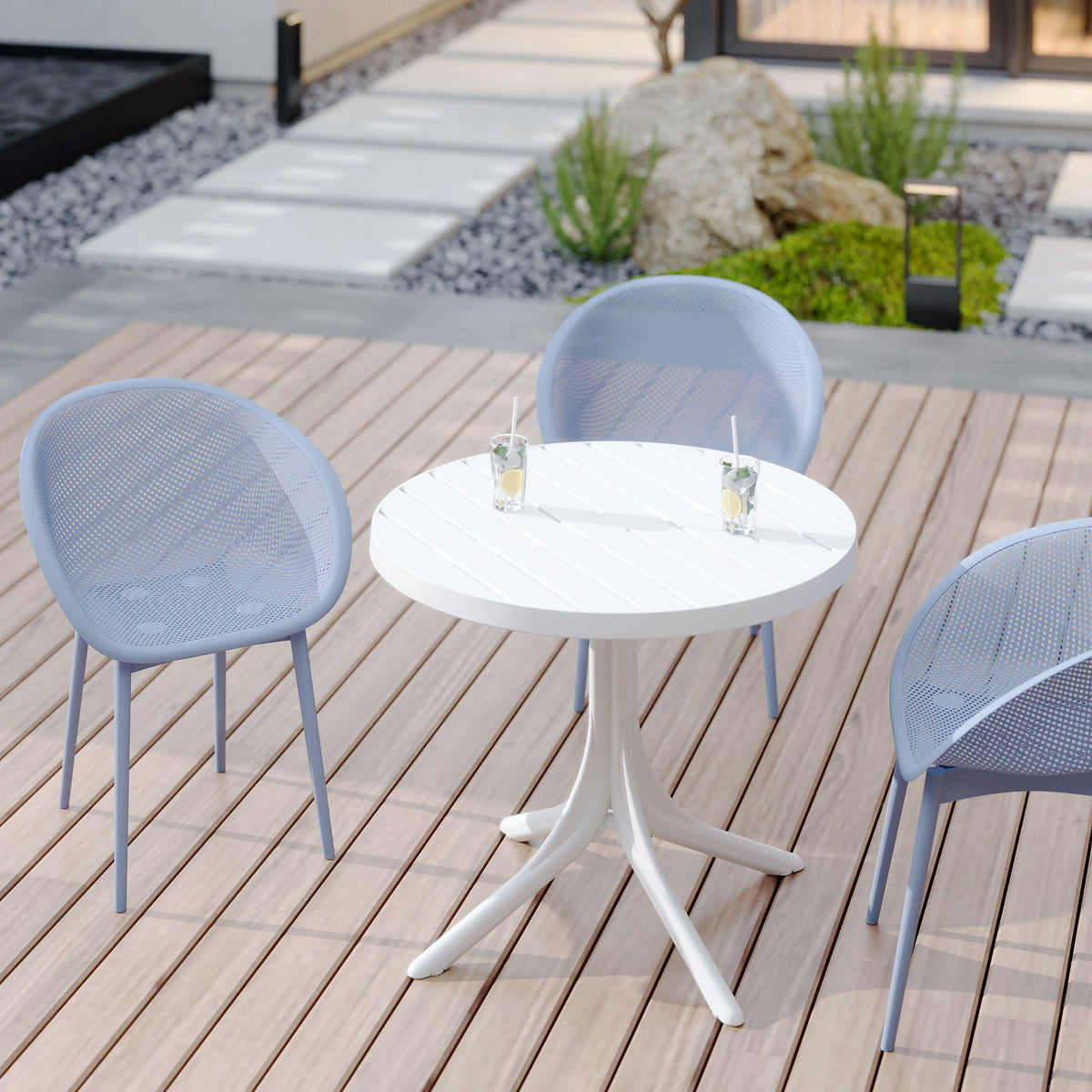 3-piece outdoor lounge set with light blue polypropylene chairs around a white round table on Tampa Home & Garden Store