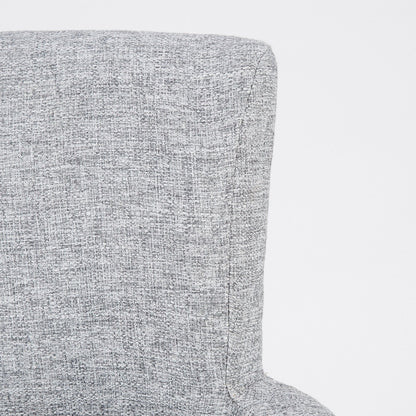 Elegant gray arm dining chair in textured upholstery, close-up of arm and corner on Tampa Home & Garden Store
