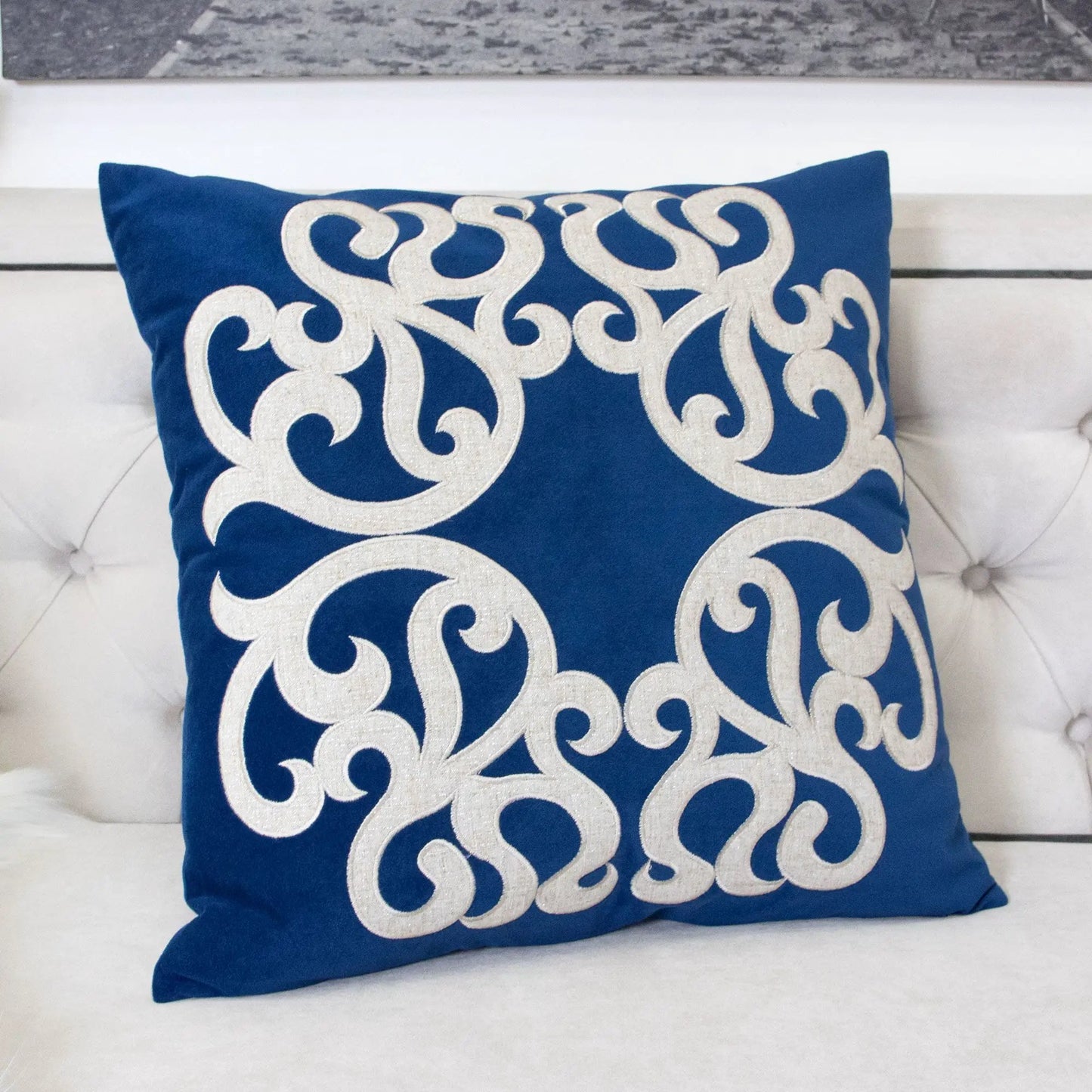 Dora pillow cover with matching back in blue fabric featuring white embroidered scroll pattern on Tampa Home & Garden Store