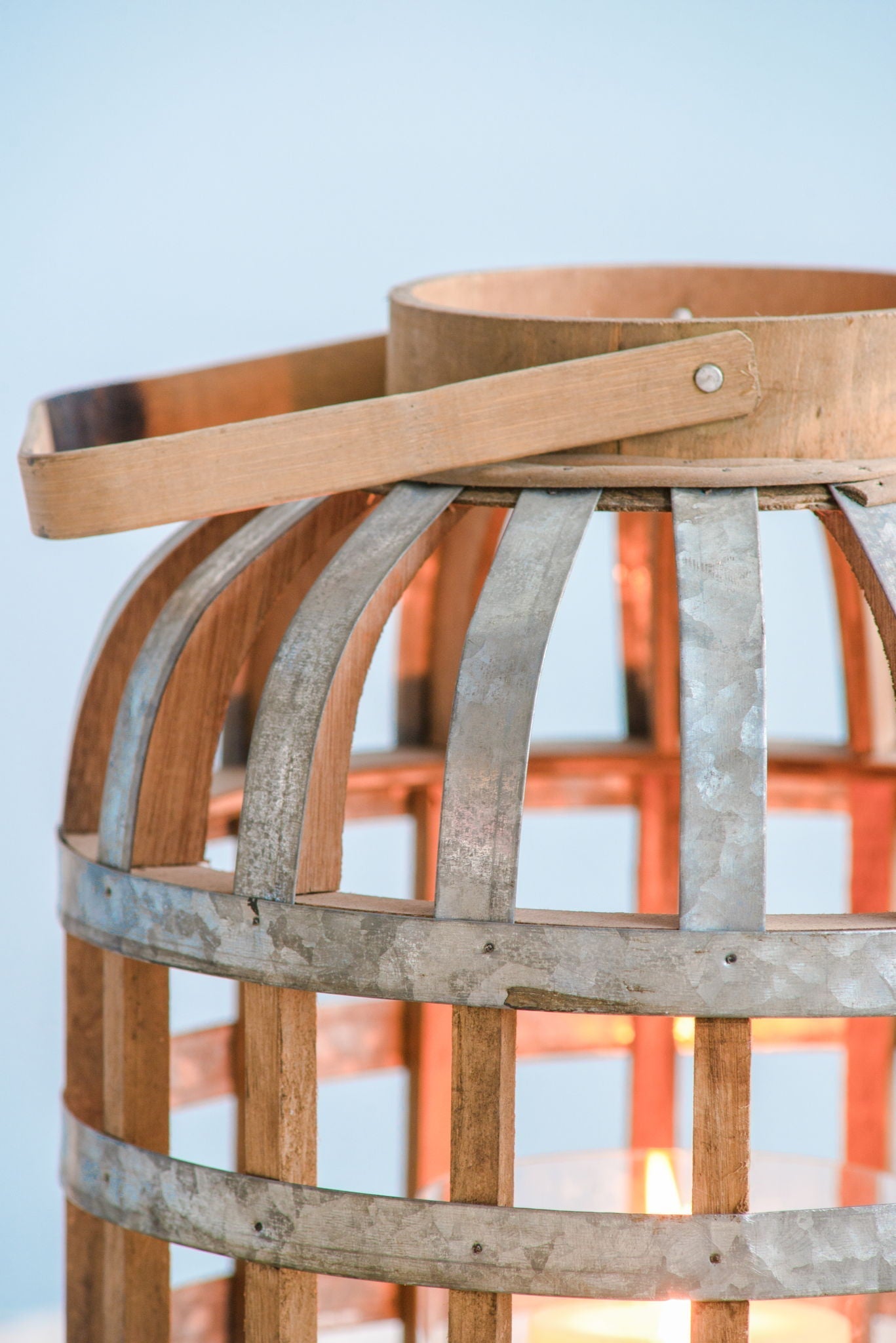 Decorative wooden lantern with metal bands and handle, rustic indoor/outdoor home decor on Tampa Home & Garden Store