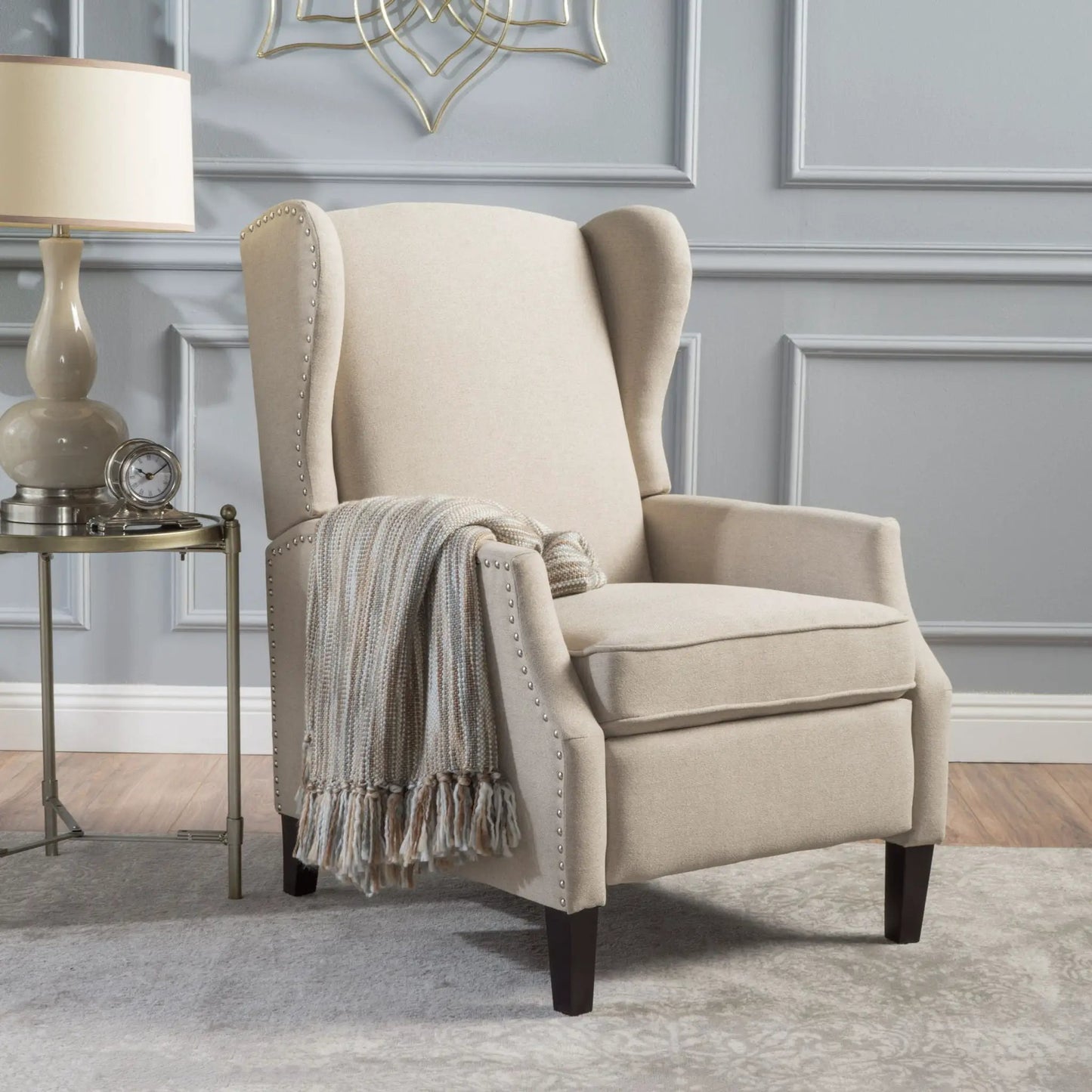 Westeros Wing Back Fabric Upholstered Recliner beige fabric with nailhead trim and dark wood legs on Tampa Home & Garden Store