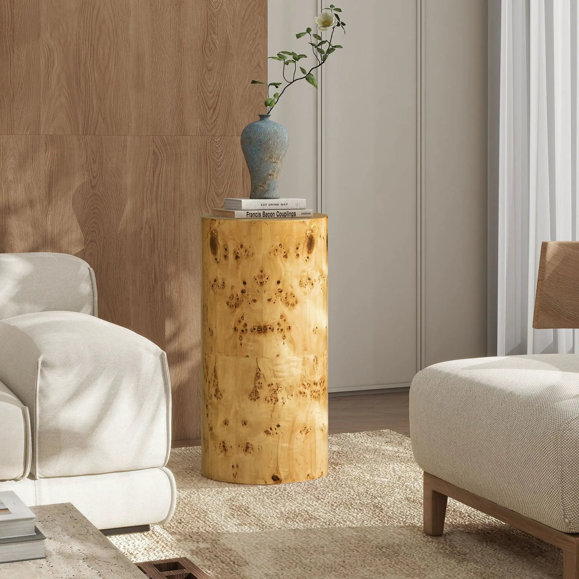 Nebula Accent Pillar Side Table in burl wood with blue ceramic vase and book stack on Tampa Home & Garden Store