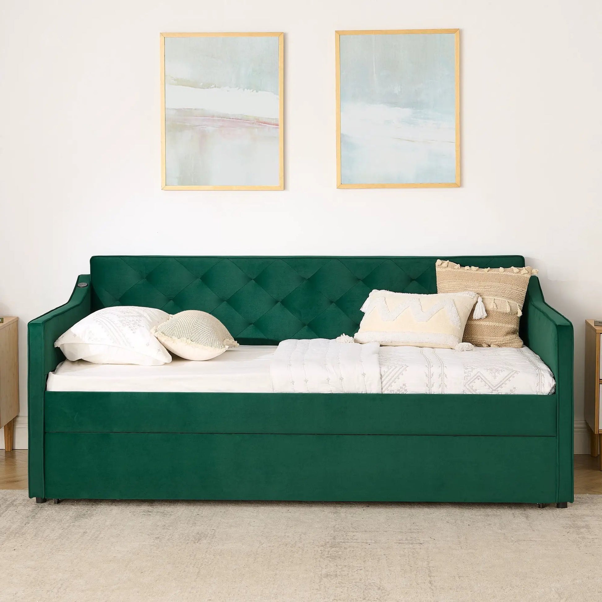 Daybed with emerald green tufted upholstery and beige decorative pillows on Tampa Home & Garden Store