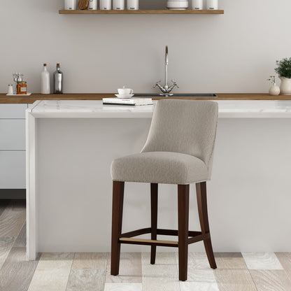 Beige upholstered counter-height stool with backrest and footrest, dark wood legs on Tampa Home & Garden Store