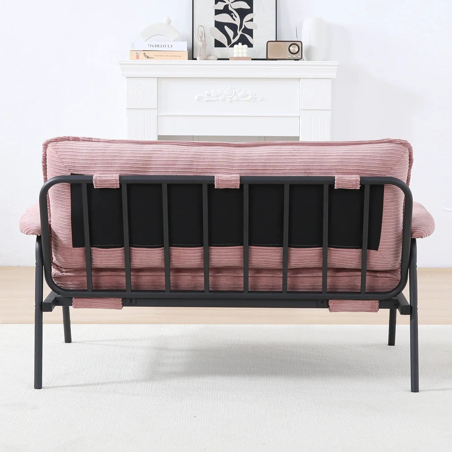 Modern metal-frame sofa with pink ribbed upholstery and sponge cushions, compact space seating on Tampa Home & Garden Store