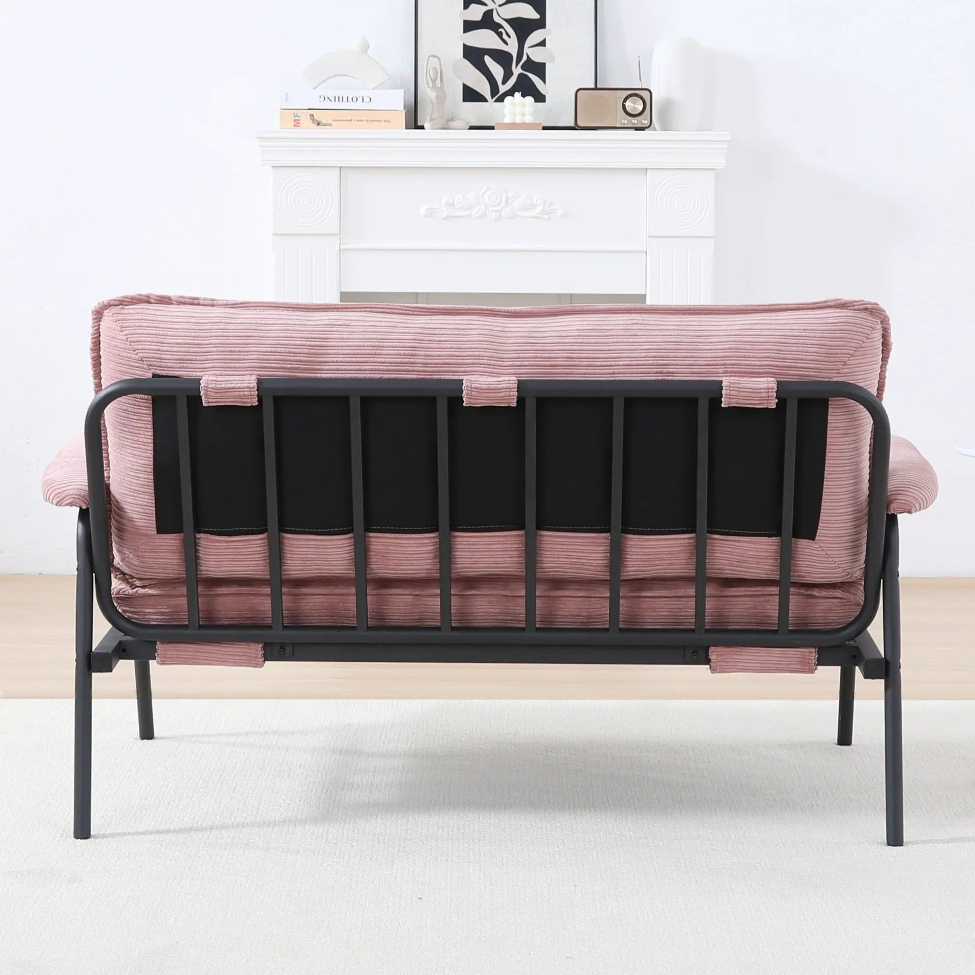 Modern metal-frame sofa with pink ribbed upholstery and sponge cushions, compact space seating on Tampa Home & Garden Store