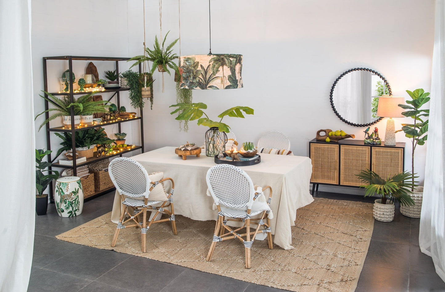 Ceramic garden stool jungle-themed accent side table by HouseOfZazla in plant-filled space on Tampa Home & Garden Store