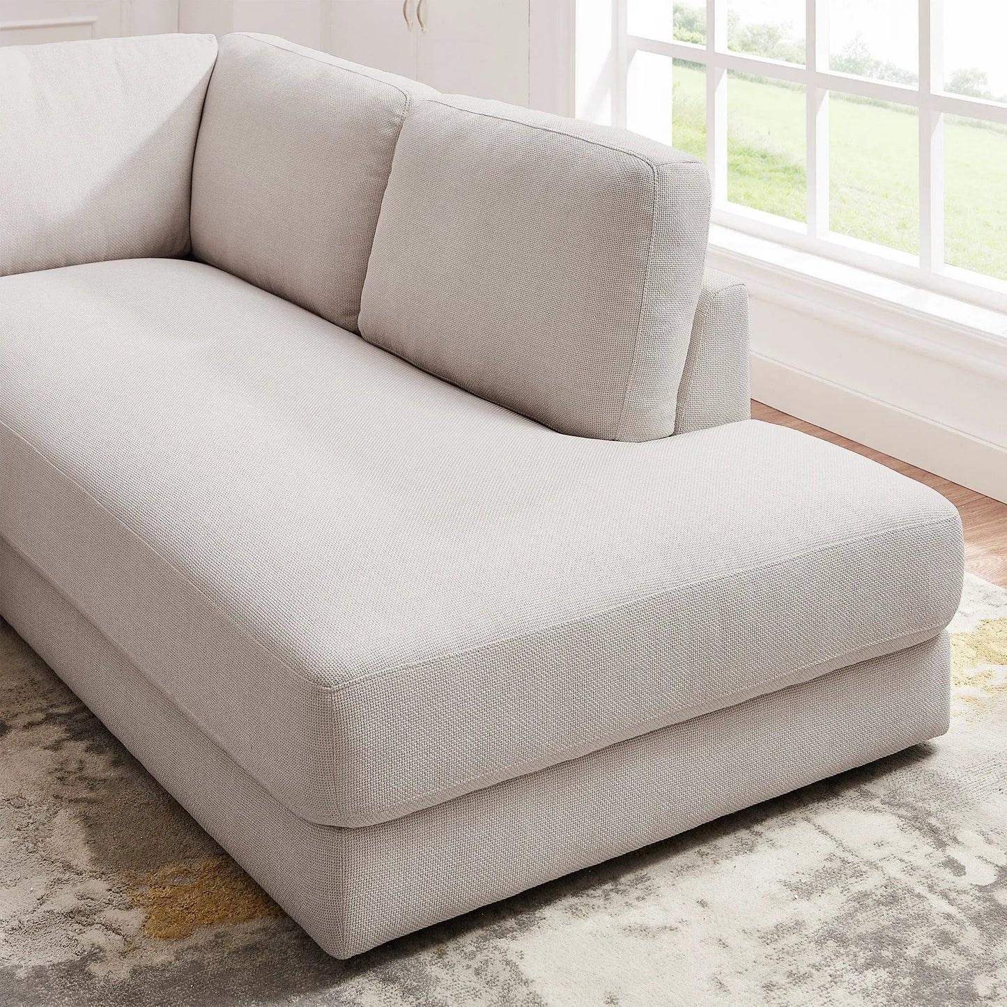 Glander cozy sectional sofa in light gray woven fabric with cushion seams, stationary unit on Tampa Home & Garden Store