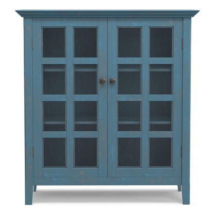 Acadian medium storage cabinet by HouseOfZazla with blue distressed finish and glass-panel doors on Tampa Home & Garden Store