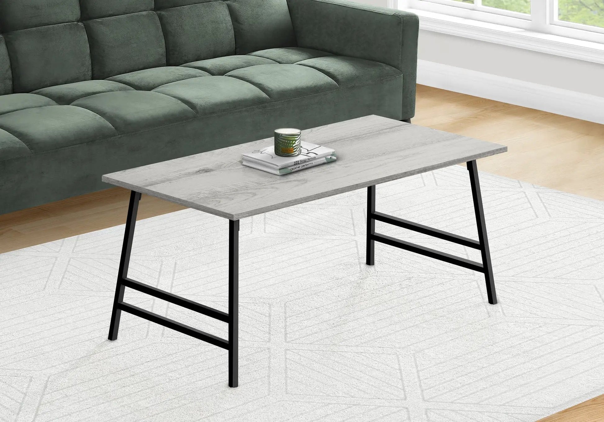 Coffee table rectangular modern with light gray wood top and black metal legs on Tampa Home & Garden Store