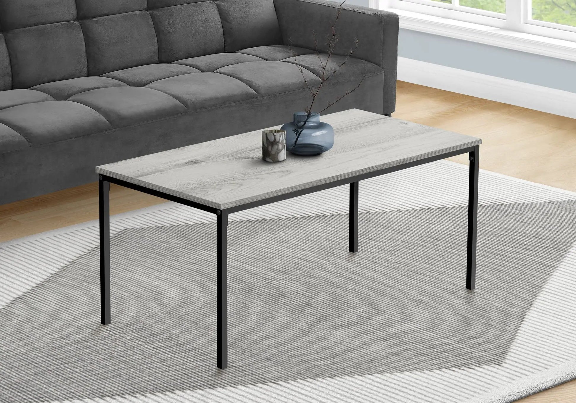 Rectangular coffee table with light gray wood top and black metal legs by Unique Piece Furniture on Tampa Home & Garden Store