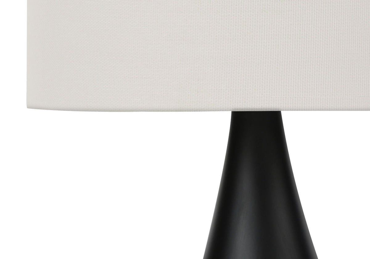 Table lamp with black base and white textured shade on Tampa Home & Garden Store