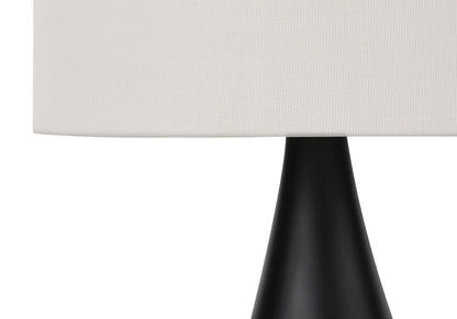 Table lamp with black base and white textured shade on Tampa Home & Garden Store