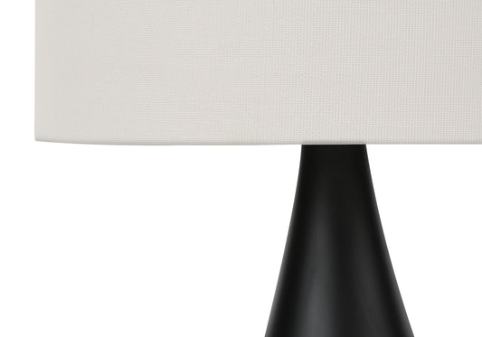 Table lamp with black base and white textured shade on Tampa Home & Garden Store