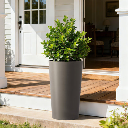Planter For Outdoor with tall gray planter housing lush green shrub on a wooden porch on Tampa Home & Garden Store