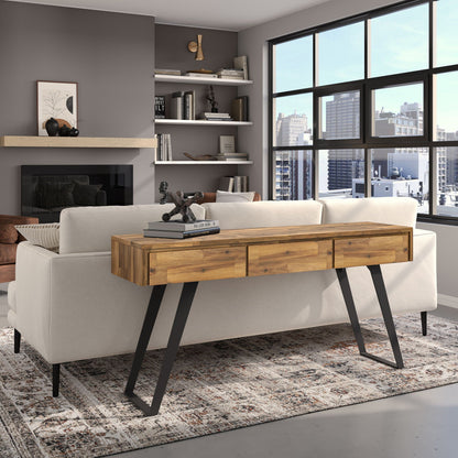 Handcrafted Acacia Console Table With Drawers in natural wood finish with black metal legs in a modern living room on Tampa Home & Garden Store
