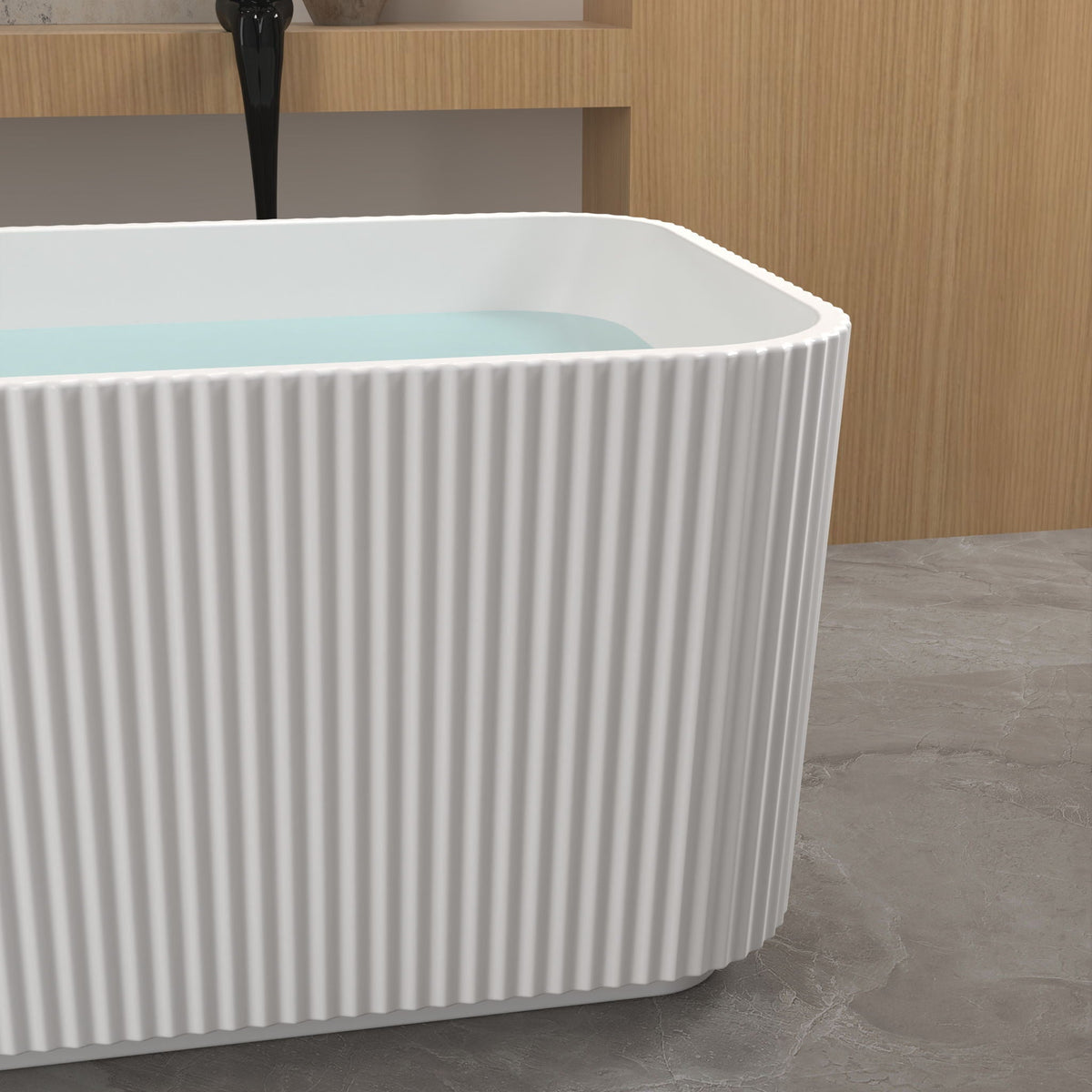 Linear freestanding soaker tub in gloss white with ribbed exterior and water inside on Tampa Home & Garden Store