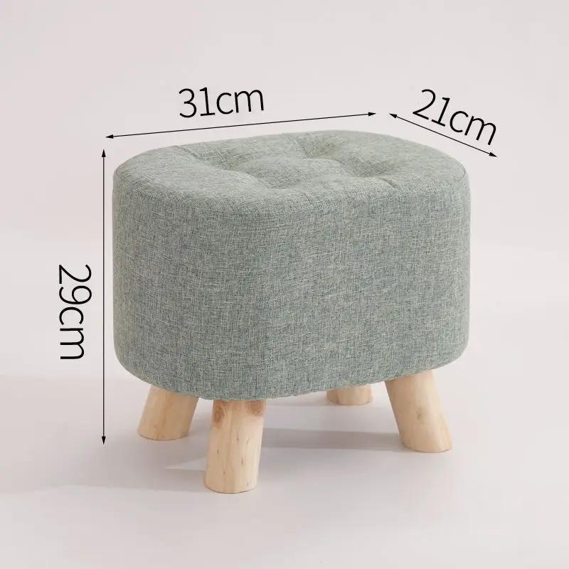 Nordic solid wood fabric ottoman stool with tufted top and four natural wood legs on Tampa Home & Garden Store