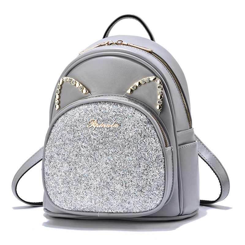 Stevvex gray PU leather backpack with glitter front pocket and cat-ear studded accents on Tampa Home & Garden Store