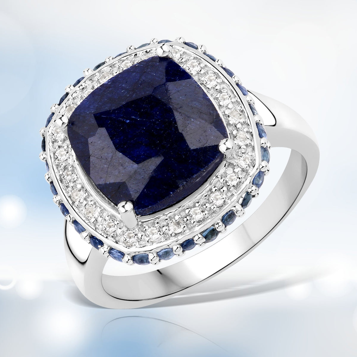 Ring with 6.46ct dyed sapphire center, white topaz halo, blue sapphire accents in sterling silver on Tampa Home & Garden Store
