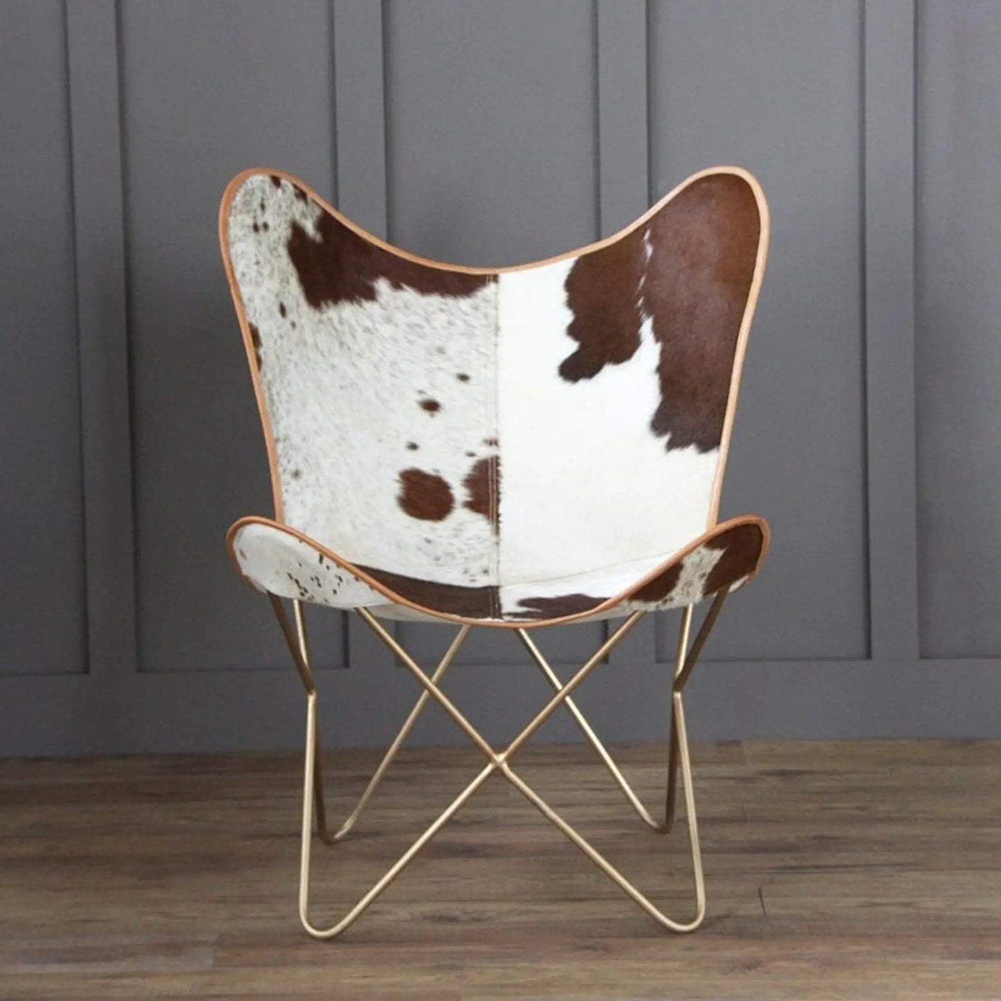 The Swiss Butterfly Chair by Classy Leather Bags with cowhide upholstery and tan leather trim on Tampa Home & Garden Store