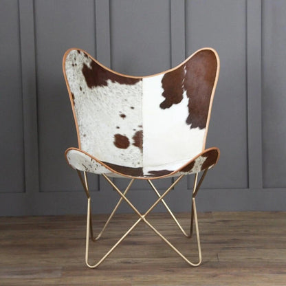 The Swiss Butterfly Chair by Classy Leather Bags with cowhide upholstery and tan leather trim on Tampa Home & Garden Store