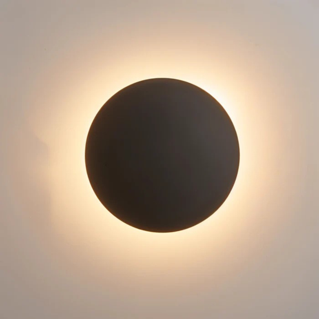 Modern LED Wall Lamp black round disc with warm backlight glow by Moktan Sabai on Tampa Home & Garden Store