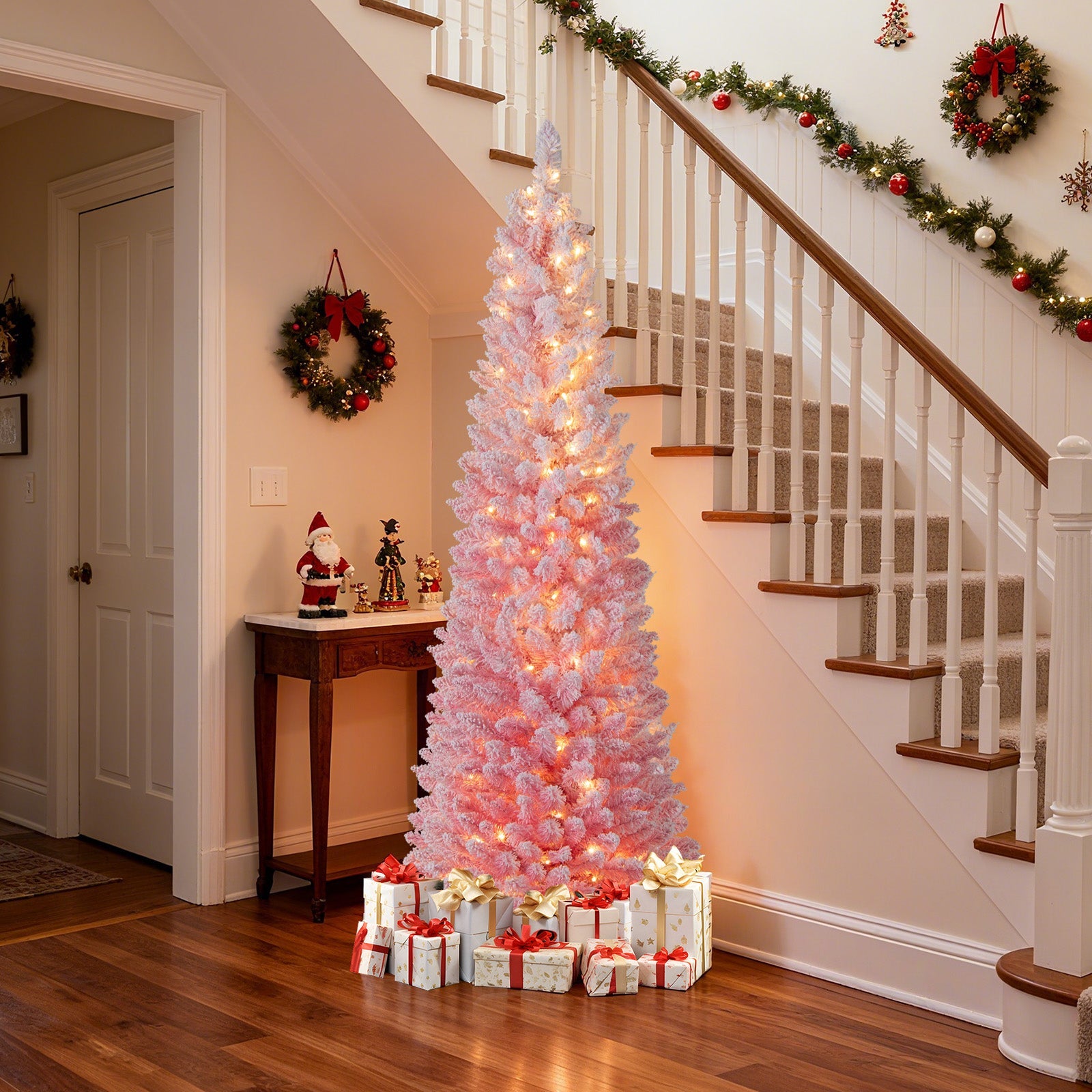 6 ft pink snow-flocked pre-lit artificial Christmas tree with hinged sections in hall on Tampa Home & Garden Store