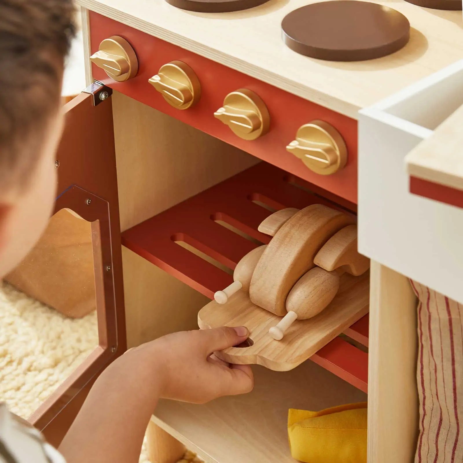 Tiny Land wooden play kitchen with red front and beige knobs on Tampa Home & Garden Store