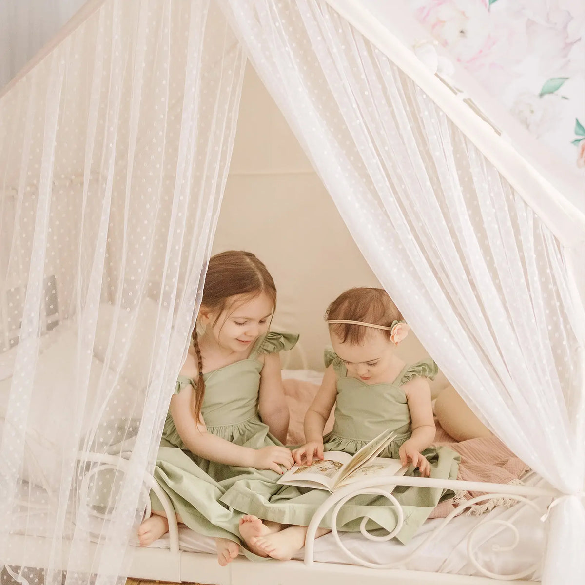 Tiny Land Kids Tent cozy play house with white dotted curtains and star lights, 3 kids inside on Tampa Home & Garden Store
