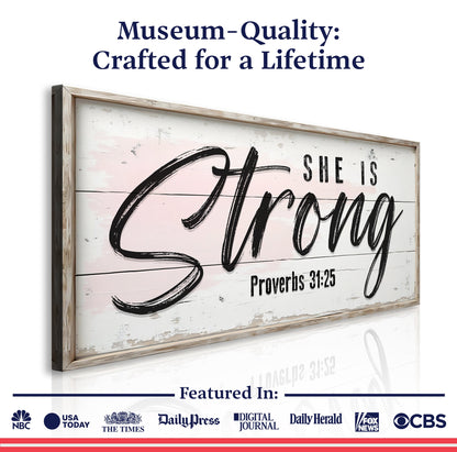 Canvas sign Proverbs 31:25 She Is Strong script on pink distressed panel with rustic frame on Tampa Home & Garden Store