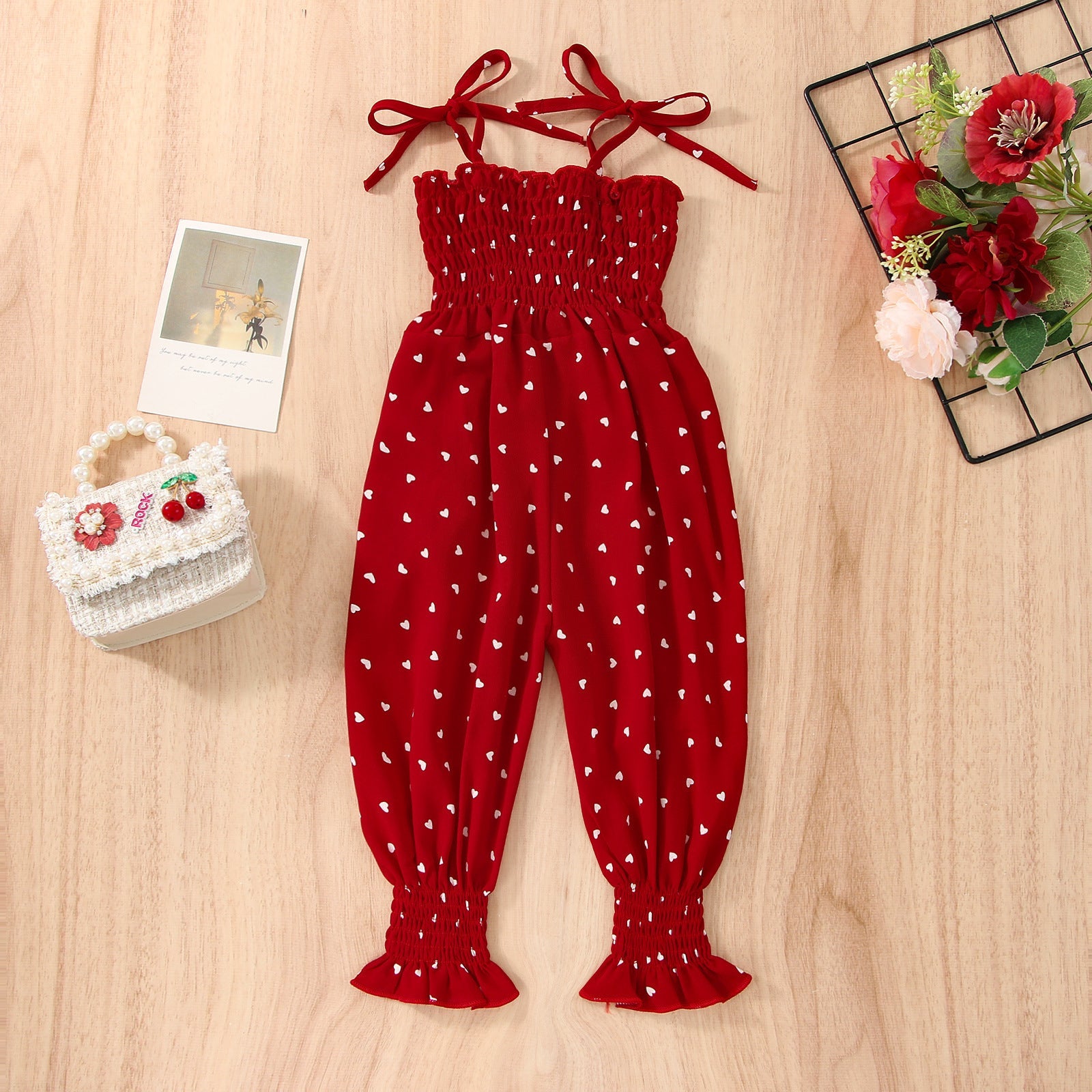 Stevvex red baby romper jumpsuit with white heart print, sleeveless smocked top and tie straps on Tampa Home & Garden Store