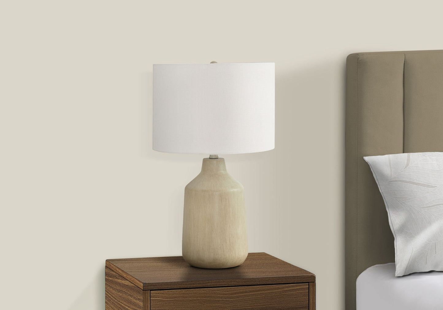 Lighting table lamp with a beige concrete-style base and white fabric shade on a nightstand on Tampa Home & Garden Store